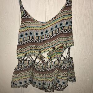LF brand tank top with tribal design and cut outs